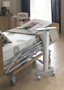 pneumatic overbed table / height-adjustable / tilting / on casters