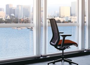 office chair / with armrests / on casters