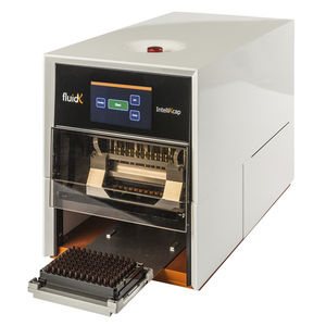 tube decapping and capping system