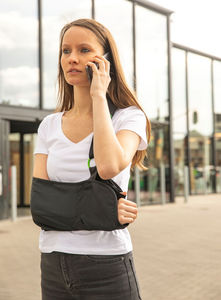 arm sling with waist support strap