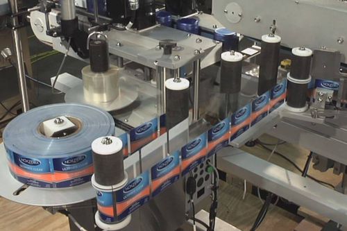 Pharmaceutical industry labeling system - Cozzoli Machine Company