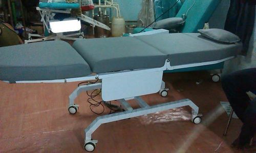 Dermatology examination table - Baseline biomedical company - electric / on casters / 4-section