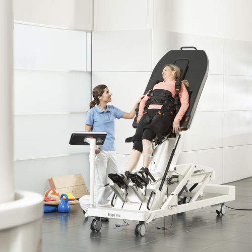 Electric tilt table - Erigo® - Hocoma  - on casters / height-adjustable / therapy