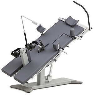 Cardiology examination table - Ergoselect 12 - NORAV Medical - electric / reclining / with pedal ergometer