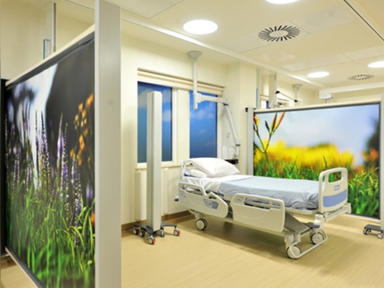 Hospital privacy screens on wheels KwickScreens at hospital ward in The National Hospital for Neurology and Neurosurgery, London.