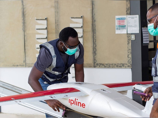 A lightweight drone takes off from one of Zipline’s distribution centers, with the package placed inside a parachute in the belly of the drone.