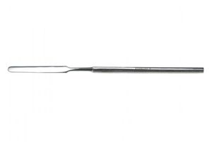 espátula com cimento dentário