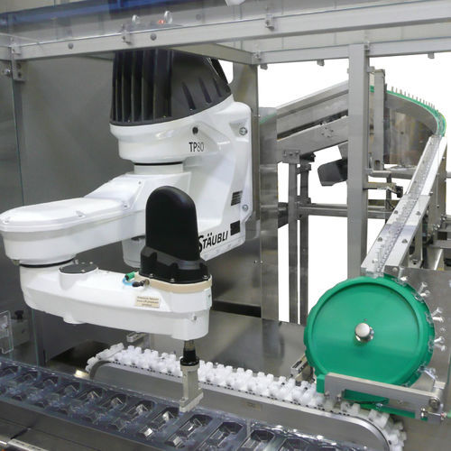 Alimentador a vácuo - Heino Ilsemann GmbH - de esteira / para máquina embaladora / para seringas
