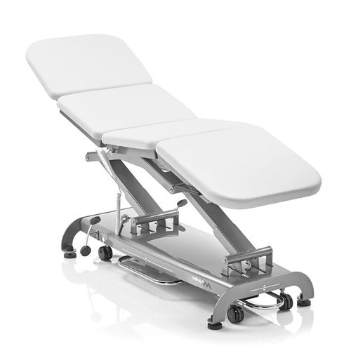 Mesa de exame elétrica - S4 - Novak M - com altura regulável / Trendelenburg / com rodízios