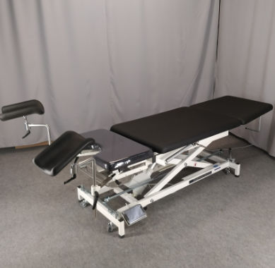 Mesa para exame ginecológico - GYNE PLUSS X1 - Fysiotech - pneumática / com altura regulável / de 2 seções